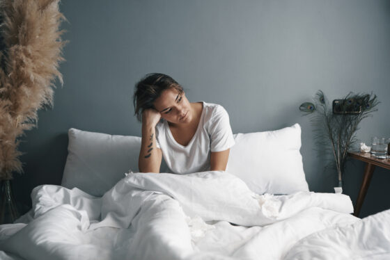 a young woman with a sad face in bed 2023 11 27 05 23 30 utc 560x374jpg
