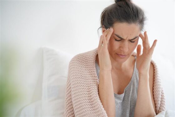 beautiful brunette bed with bad headache 560x374jpg